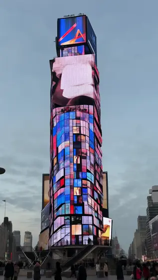 A detailed, photorealistic image of a single rectangular tower structure, where the entire surface of the tower is cover