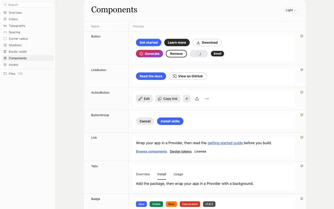 The design-system editor showing interactive React Spectrum buttons, links, labels, tables, and status components