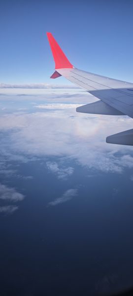 Airplane Wing View Over Cloud Sea